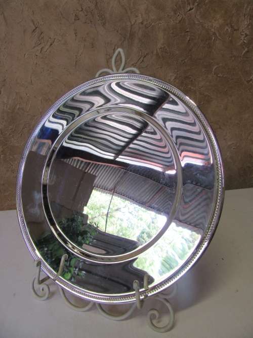 This timeless silver metal under plates will find itself on some of the best tables around.