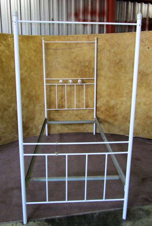 A BEAUTIFUL WHITE FOUR POST SINGLE BED WITH STUNNING PORCELAIN DETAIL