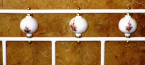 A BEAUTIFUL WHITE FOUR POST SINGLE BED WITH STUNNING PORCELAIN DETAIL