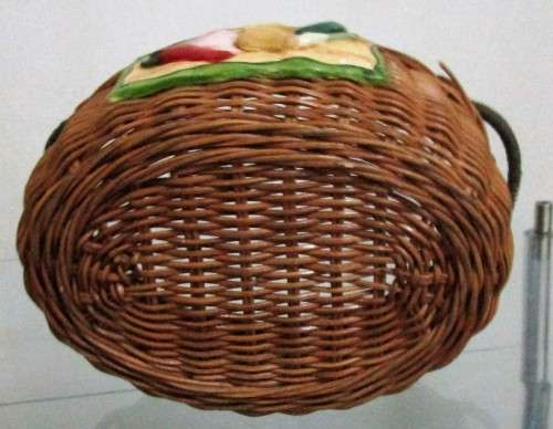 A Gorgeous Country style Oval Wicker Basket with Handles and Ceramic decorative plaque