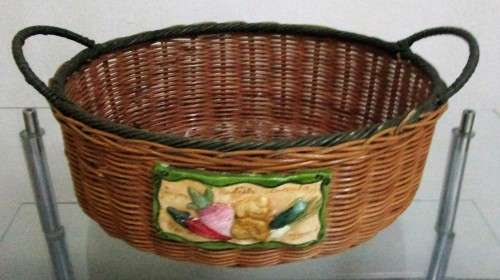 A Gorgeous Country style Oval Wicker Basket with Handles and Ceramic decorative plaque