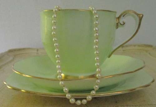 This lovely mid-century Trio Tea cup Set were made in England by Bell  China. A Beautiful Light Past