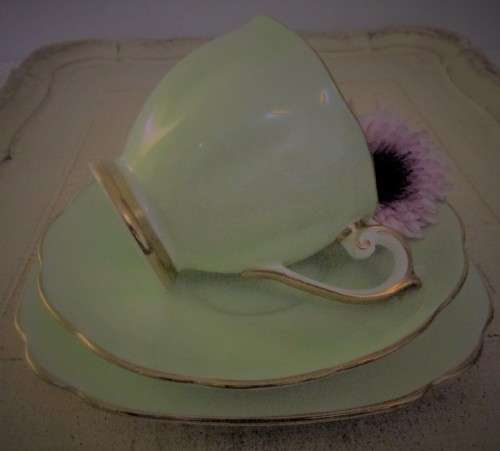This lovely mid-century Trio Tea cup Set were made in England by Bell  China. A Beautiful Light Past