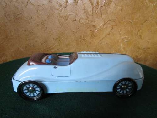 A FANTASTIC CAR SHAPED COOKIE TIN -