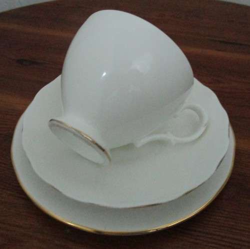 A Stylish Vintage Queen Anne England Trio Set in a Crisp White with a lush Gold Trim