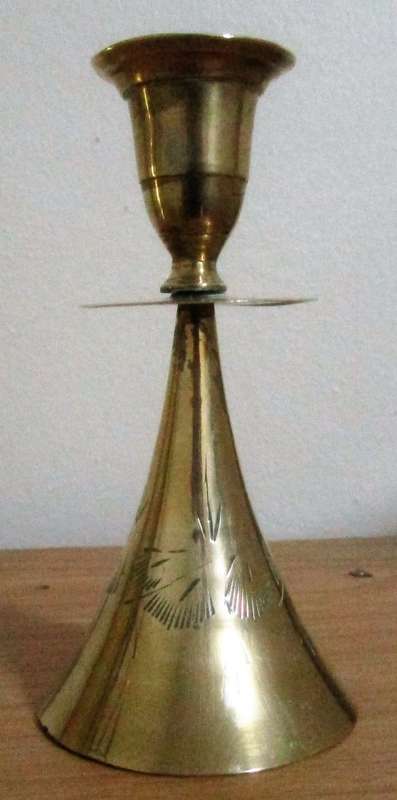 A MARVELOUS BRASS CANLE HOLDER ON TOP AND BELL ON THE BOTTOM SIDE