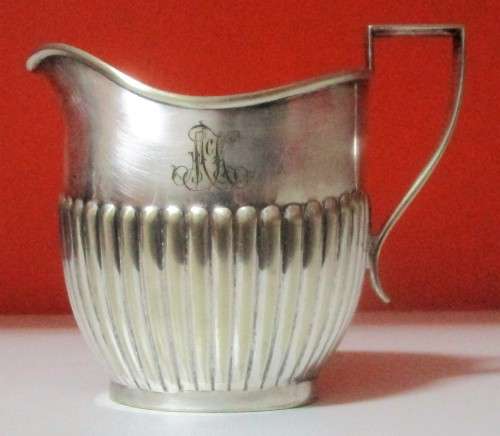 A MARVELOUS - Sheffield Style Milk Creamer that really speaks to the art deco style.