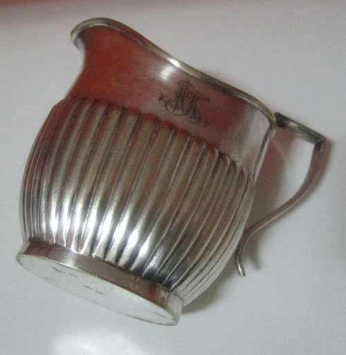 A MARVELOUS - Sheffield Style Milk Creamer that really speaks to the art deco style.