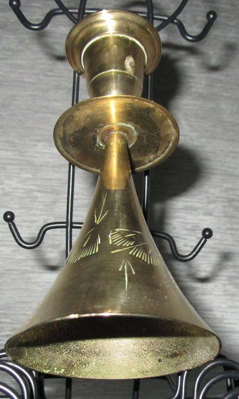 A MARVELOUS BRASS CANLE HOLDER ON TOP AND BELL ON THE BOTTOM SIDE
