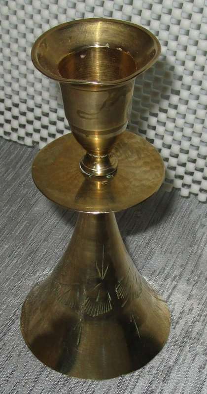 A MARVELOUS BRASS CANLE HOLDER ON TOP AND BELL ON THE BOTTOM SIDE
