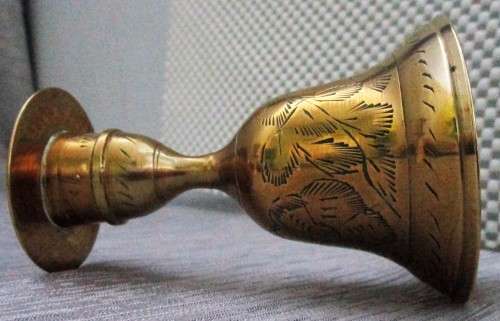 A MARVELOUS BRASS CANLE HOLDER WITH CANDLE ON TOP AND BELL ON THE BOTTOM SIDE - NO RINGER