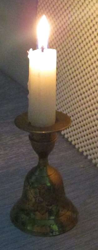 A MARVELOUS BRASS CANLE HOLDER WITH CANDLE ON TOP AND BELL ON THE BOTTOM SIDE - NO RINGER