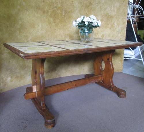 A FANTASTIC VINTAGE TABLE WITH STUNNING DETAIL WITH THE ORIGINAL TILED TOP