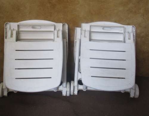 TWO FANTASTIC WHITE FOLD UP LOUNGERS ON WHEELS PERFECT FOR THIS SUMMER WEATHER BID PER EACH