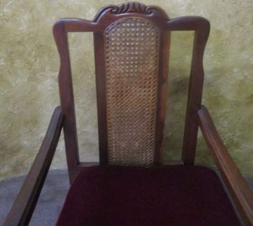 A GORGEOUS SOLID IMBUIA BOW BACKED BALL & CLAW ARM CHAIR WITH A RARE WEAVED RATTAN BACK
