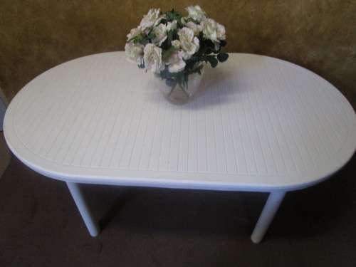 A OVAL SIX SEATER OUSIDE TABLE - LEGS CAN PULL OUT FOR EASY STORAGE