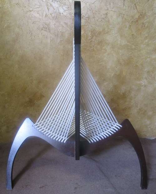 A EXQUISITE DESIGNER CHAIR WITH A DARK WOOD AND ROPE DESIGN ABSOLUTELY STUNNING