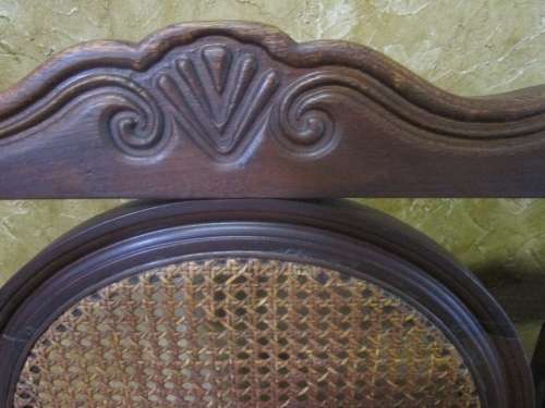 A beautiful solid Wood Ball & Claw parlour couch with wicker backrest in great condition!!!