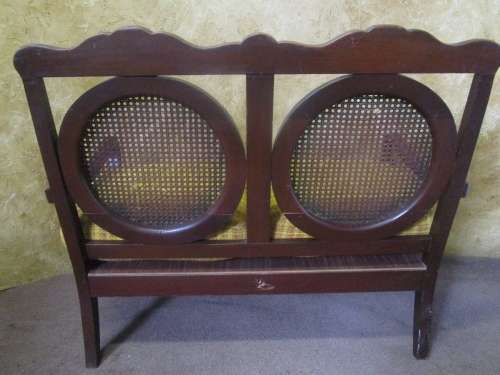 A beautiful solid Wood Ball & Claw parlour couch with wicker backrest in great condition!!!