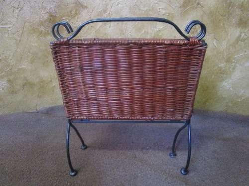 A LOVLEY WEAVED CANE AND METAL FOLD UP MAGAZINE RACK