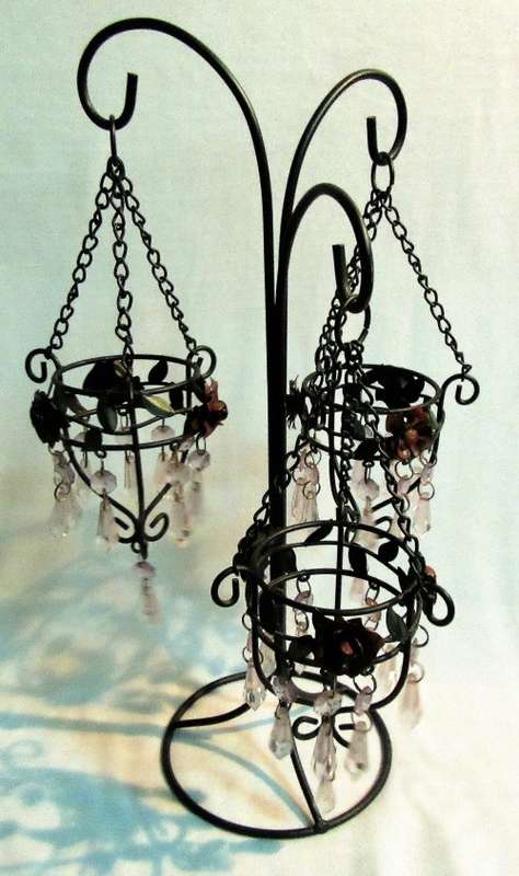 A BEAUTIFUL DESIGNED THREE TIER CANDLE HOLDER WITH STUNNING DETAIL