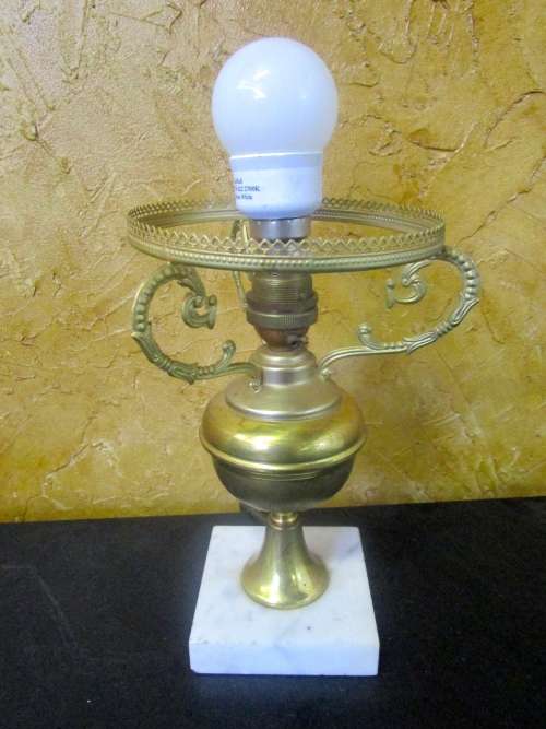 This is a gorgeous brass lamp with a large finial and a marble base