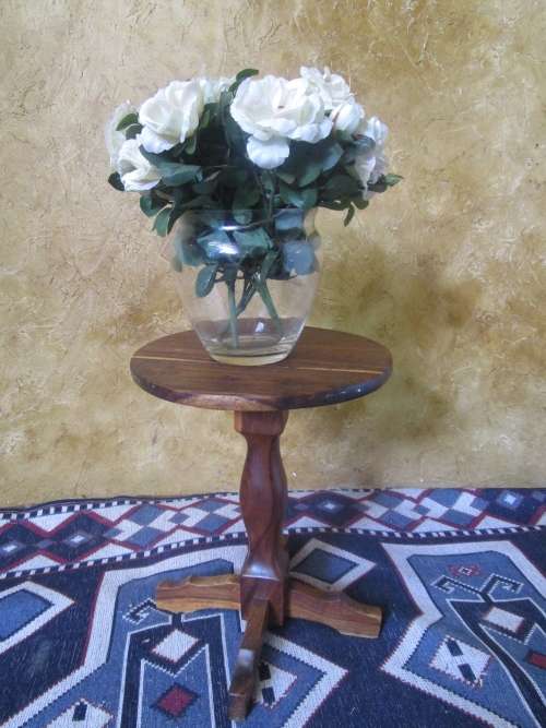 A MARVELOUS SOLLID WOOD COFFEE TABLE RESTING ON THREE LEGS