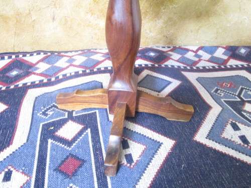 A MARVELOUS SOLLID WOOD COFFEE TABLE RESTING ON THREE LEGS