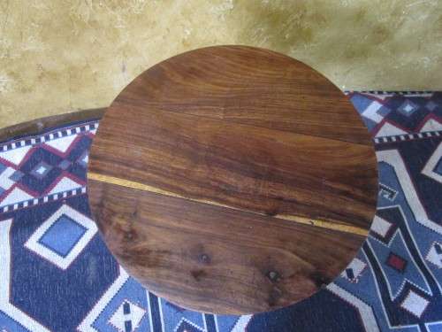 A MARVELOUS SOLLID WOOD COFFEE TABLE RESTING ON THREE LEGS