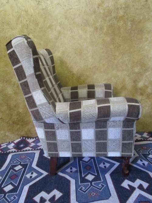 A CHARMING COMFORTABLE WING BACK CHAIR IN EXCELLENT CONDITION