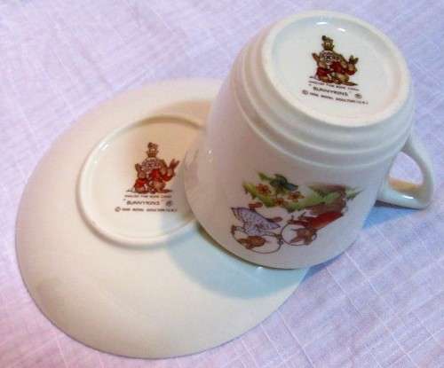 This is a "Bunnykins" child's mug and saucer set by Royal Doulton China. The set is perfect