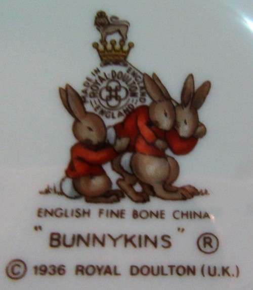 This is a "Bunnykins" child's mug and saucer set by Royal Doulton China. The set is perfect