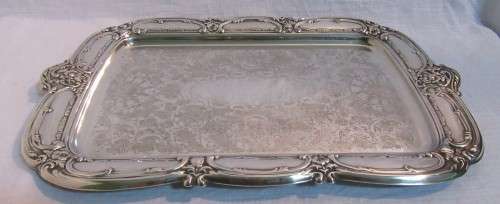 A Stylish Vintage rectangular silver plated tray. The base has ornate chased decoration and a raise