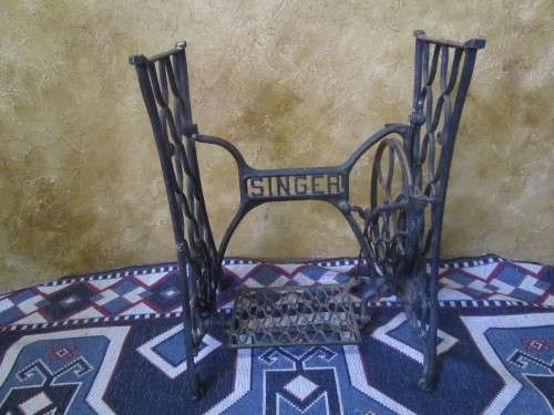 A ELEGANT ANTIQUE SINGER STAND - ADD A TOP AND USE IT FOR A BASIN STAND WILL BE A CONVERSASION PIECE