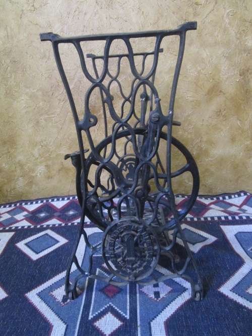 A ELEGANT ANTIQUE SINGER STAND - ADD A TOP AND USE IT FOR A BASIN STAND WILL BE A CONVERSASION PIECE