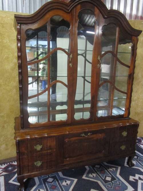 Spectacular large "gabled" ball and claw display cabinet with glass shelves and four drawers & door