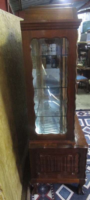 Spectacular large "gabled" ball and claw display cabinet with glass shelves and four drawers & door