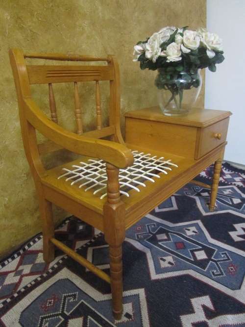 A MARVELOUS VINTAGE OAK TELEPHONE TABLE WITH RIEMPIES STUNNING PIECE