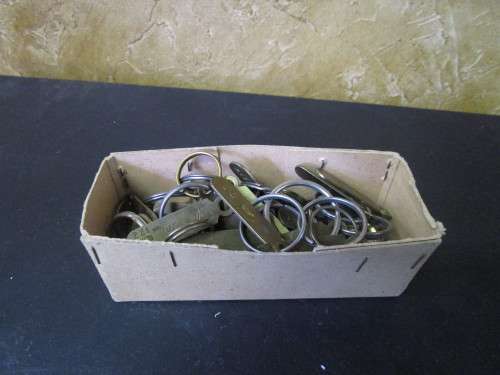 A JOBLOT OF NUMBERED BRASS KEY RINGS ONE BID FOR ALL