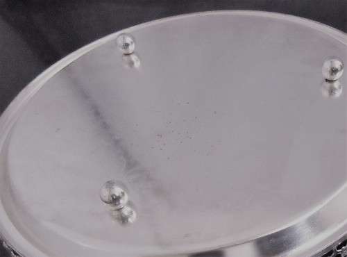 A Vintage Silver plated serving tray - Tray is round, has a pierced gallery edge and a ornate chased