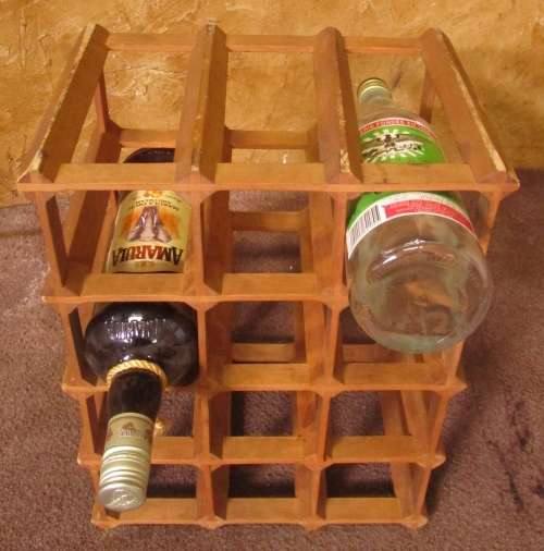 A GOOD SIZE WINE RACK FOR THE KITCHEN OR PUB OR DRINKING TROLLEY ON THE PATIO
