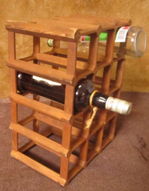 A GOOD SIZE WINE RACK FOR THE KITCHEN OR PUB OR DRINKING TROLLEY ON THE PATIO