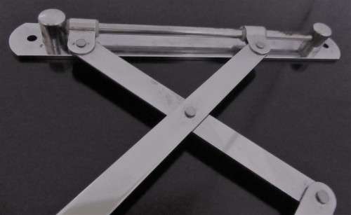 A Very useful scissor arm mirror. This mirror has incredible patina.