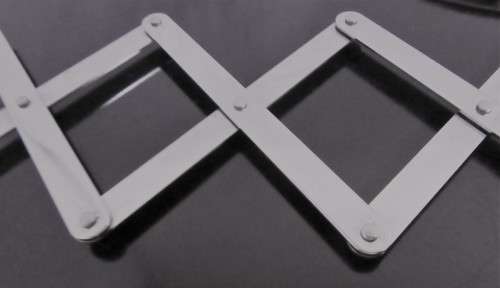 A Very useful scissor arm mirror. This mirror has incredible patina.