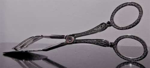 A Italian silver plate ornate serving tongs. Scissor style tongs with a ornate design on the handle