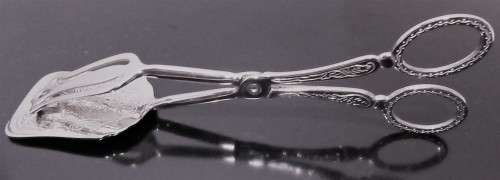 A Italian silver plate ornate serving tongs. Scissor style tongs with a ornate design on the handle