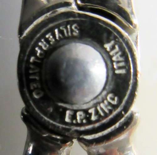 A Italian silver plate ornate serving tongs. Scissor style tongs with a ornate design on the handle