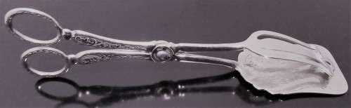 A Italian silver plate ornate serving tongs. Scissor style tongs with a ornate design on the handle
