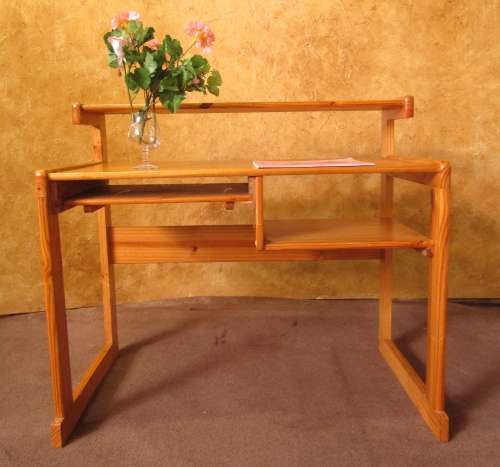 A LOVELY SOLLID WOOD DESK WITH A PULL OUT TRAY FOR YOUR KEYBOARD