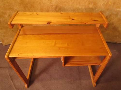 A LOVELY SOLLID WOOD DESK WITH A PULL OUT TRAY FOR YOUR KEYBOARD